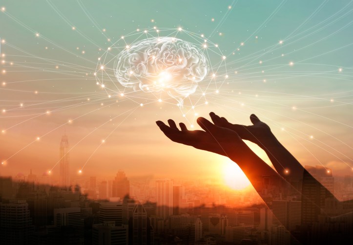 Abstract palm hands touching virtual brain with network connections, innovative technology in science and communication concept